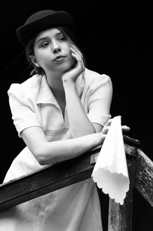 1940s fashion lady waiting with a handkerchief