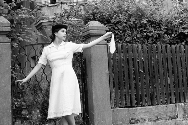 1940s fashion lady waving with a handkerchief